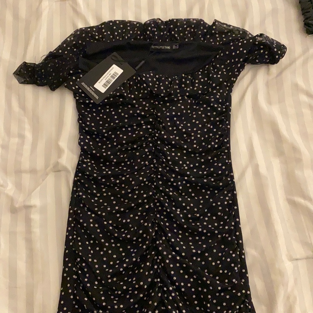 Black polka dot mesh ruched frill hem bodycon dres